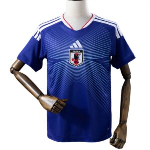 Camisa azul da seleção japonesa tailandesa 1.1 com escudo bordado e detalhes em linhas brancas.